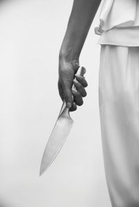spooky-image-of-knife-and-womans-hand-high-res-stock-photography-516422143-1541565531